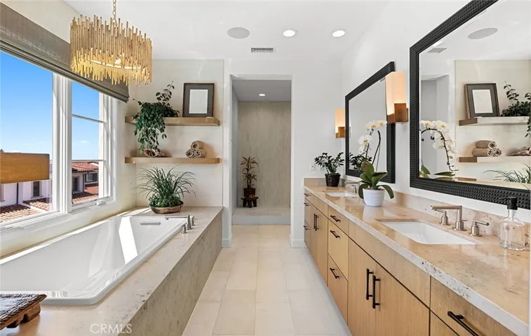 Primary bath with amazing ocean, sunset, whitewater, SC Island, coastline, and nature preserve views from soaking tub and shower.