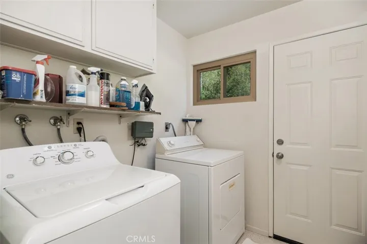 Full Laundry room off kitchen hallway.