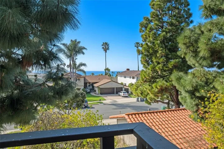 Primary bedroom balcony with view to the front. Ocean is beyond.