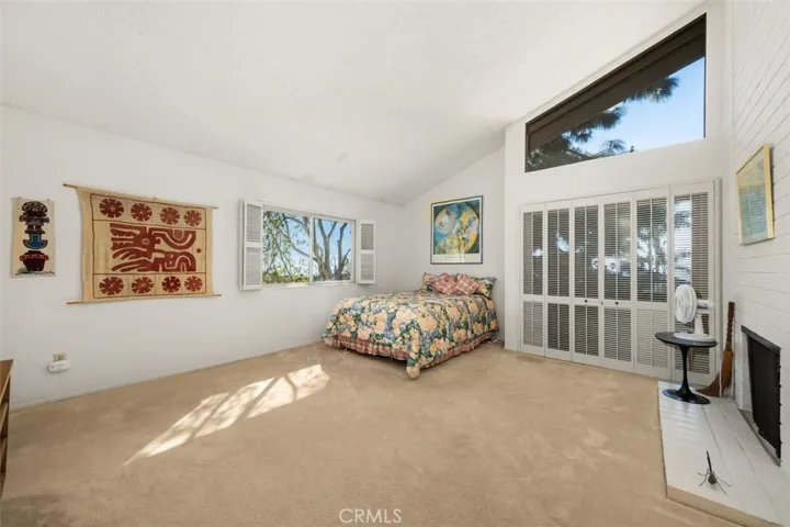 Primary bedroom with en suite, and sliding doors to balcony.
