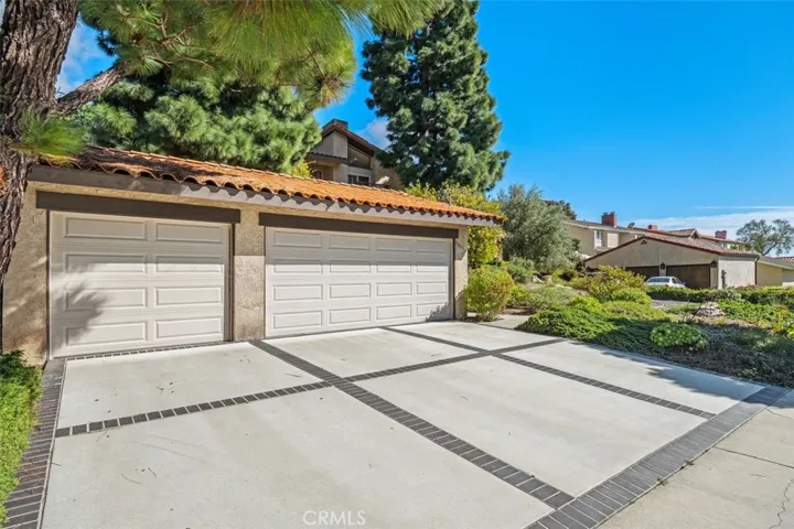 Three-car garage with storage and work bench