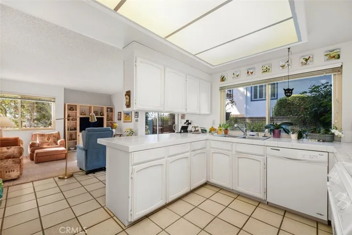 Kitchen opens to casual living room