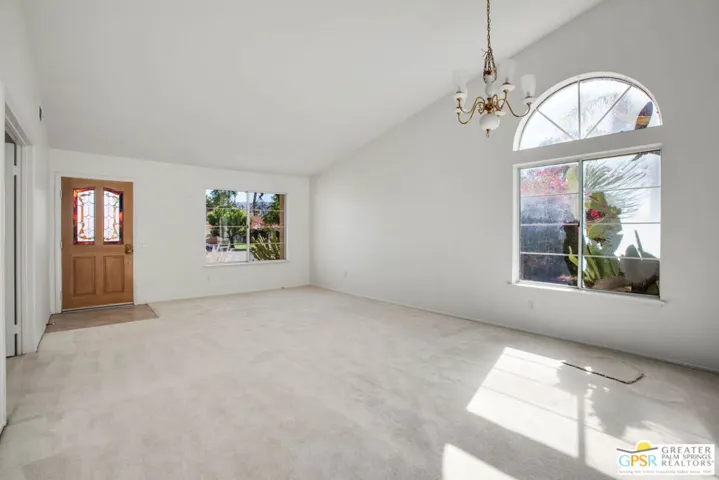 Living room with vaulted ceilings