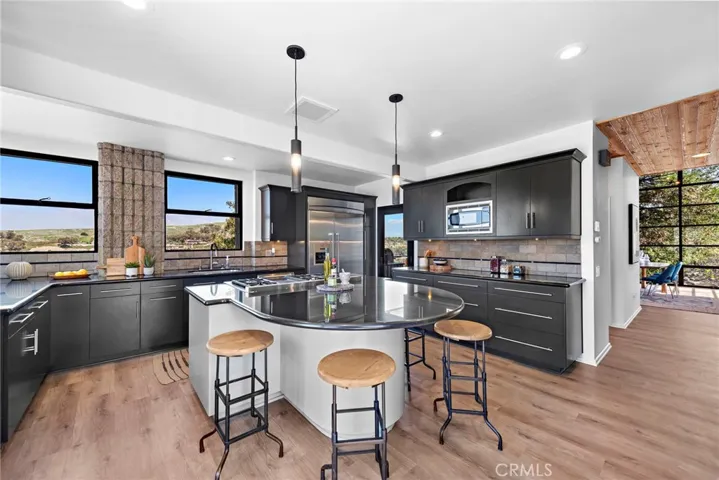 light, bright and airy kitchen facing the back of the house