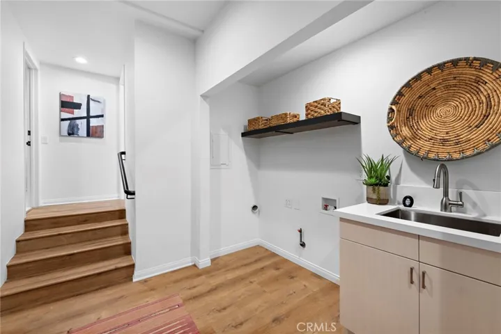 downstairs is the laundry space with a built in sink