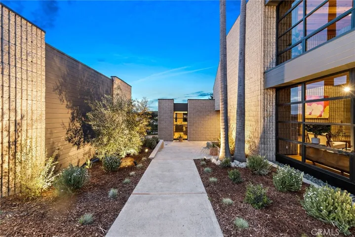 Custom landscaping, entrance to house via a private courtyard