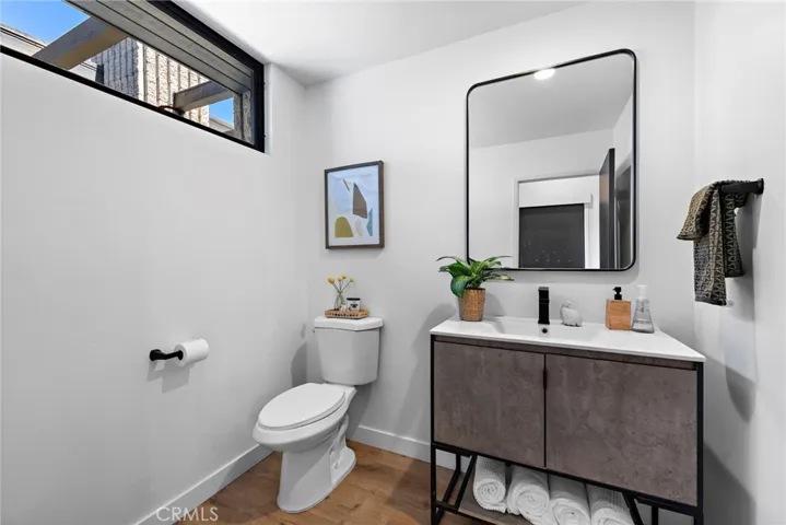 main level half bathroom, located between kitchen and dining room