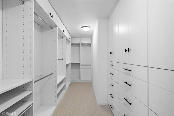 Large primary bedroom walk in closet