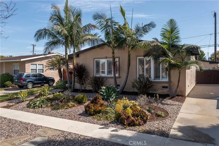 The front yard has been newly landscaped w/drought resistant plants, self watering system along with accent lighting