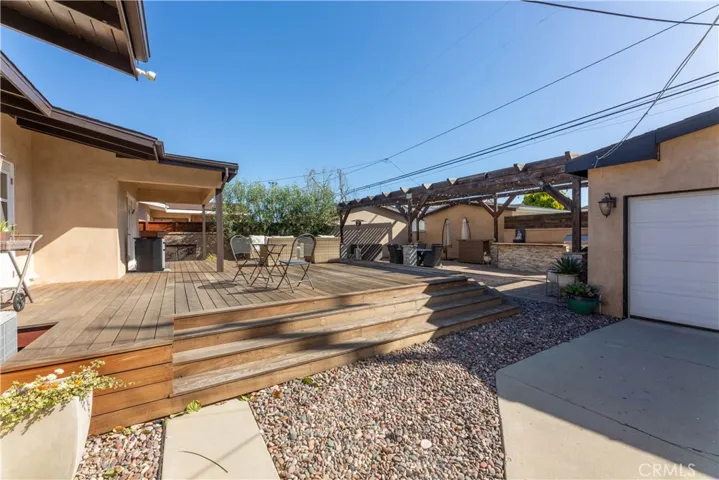 The back has had a complete transformation with the deck addition, landscaping and the gorgeous olive trees.
