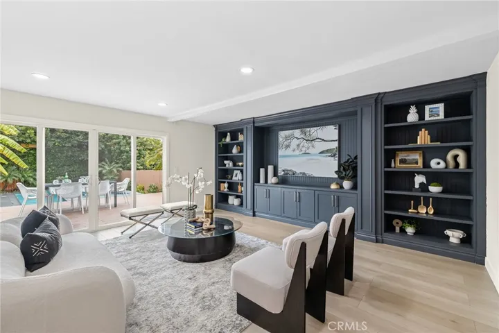 Family room opens to lower level deck, yard and pool