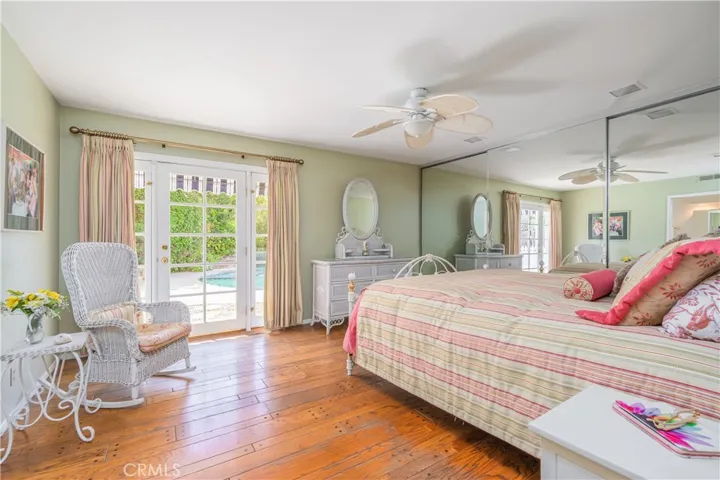 Downstairs Primary Suite Leading to Sparkling Pool