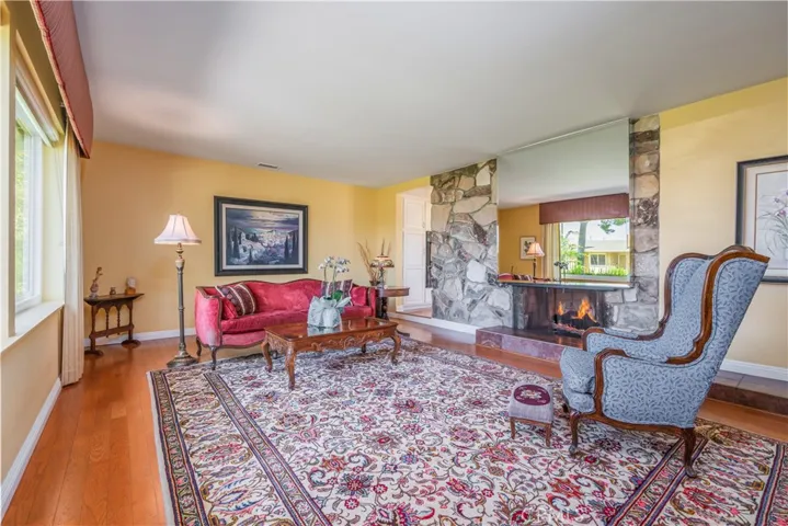 formal living room with cozy 2 way fireplace