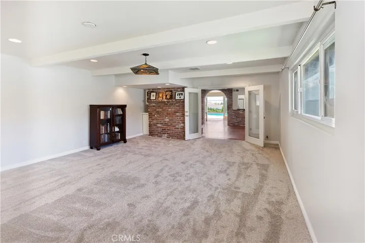 As you step inside, you're greeted by a sense of spaciousness and freedom, thanks to the generous proportions of the room and the abundant natural light streaming in through large windows. The possibilities for this bonus room are as vast as your imagination—whether you envision it as a dedicated game room, complete with a pool table, dart board, and arcade games, or as a cozy playroom for kids filled with toys, books, and creative activities.