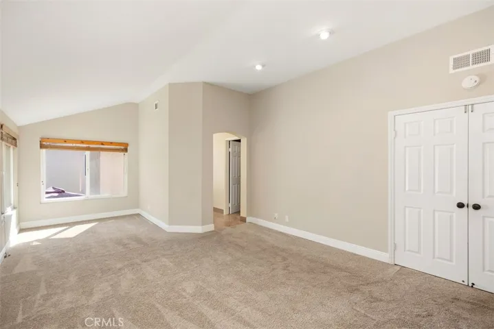 Stroll upstairs and walk into the main bedroom through the double doors to enjoy the retreat area,