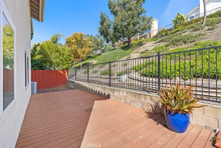 Enjoy the private and spacious backyard, nestled up to the greenbelt slope