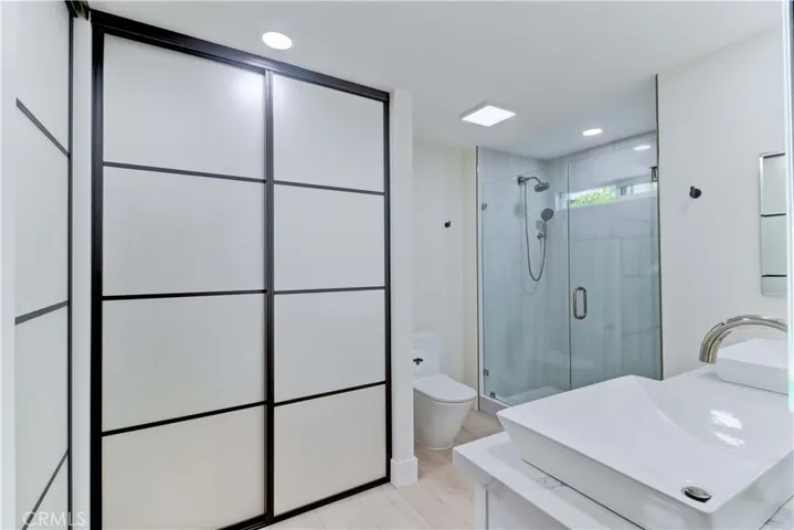 PRIMARY BATHROOM AND CLOSETS