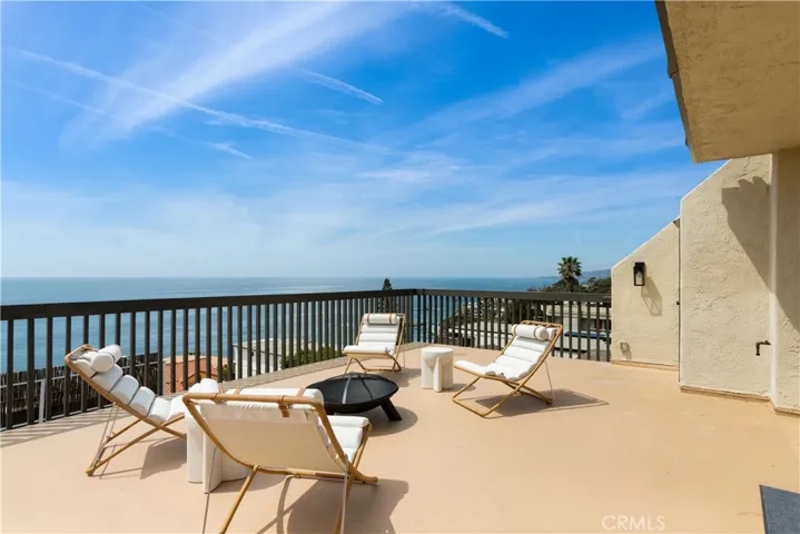 Sweeping water and coastline views from the large deck, ideal for entertaining.