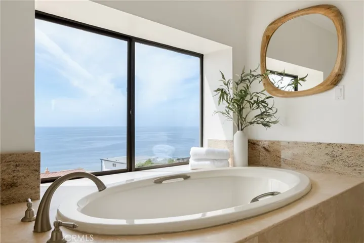 Coastline views from the Primary Bathroom.
