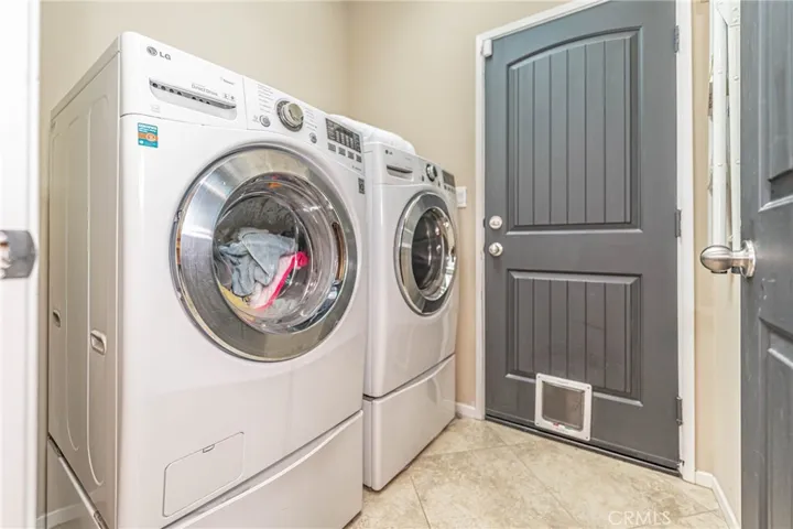 Laundry room with access to garage.