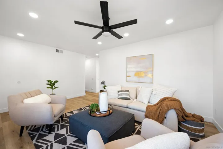 Open the front door and you're greeted by this very bright and inviting living room.