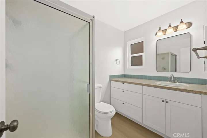 Master bathroom with new fixtures, cabinets and light fixture
