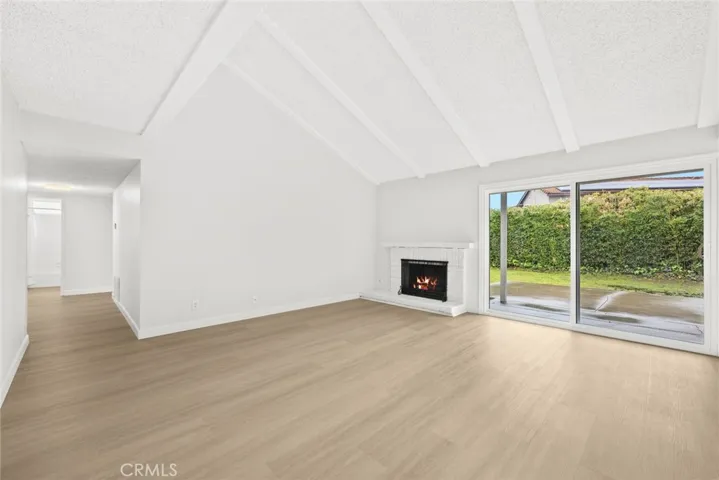 Cathedral ceiling and expose beams frame accentuates the space
