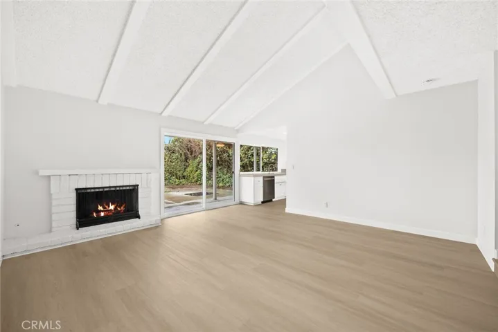 Family room with fireplace, cathedral ceiling and brand new sliding door