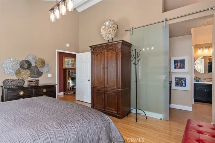 primary bath entrance with glass barn door