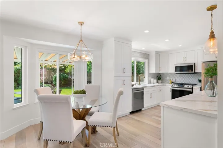 The convenient breakfast nook area is just off the kitchen & boasts wonderful backyard views.
