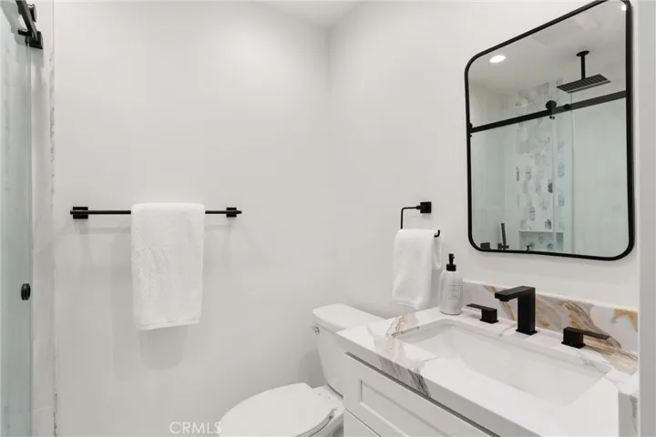 This downstairs bathroom #2 boasts a no step shower entrance