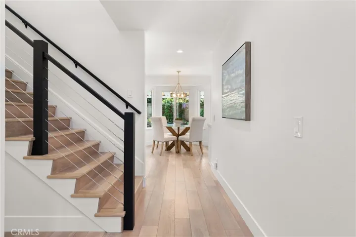 Notice the upgraded luxury vinyl flooring & new stair handrails.