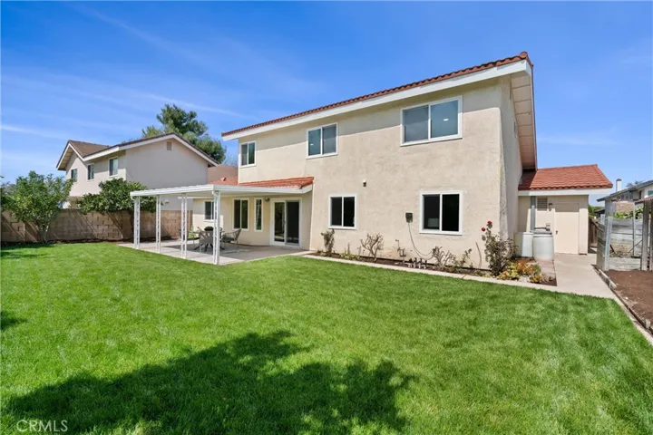This large and private backyard has multiple mature fruit trees, garden space and more