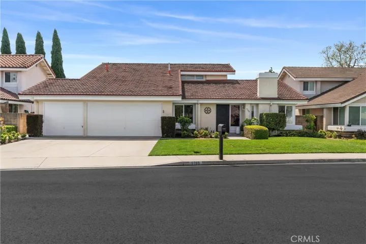 97698 Emmons welcomes you, with a 3 car garage & extra wide driveway.