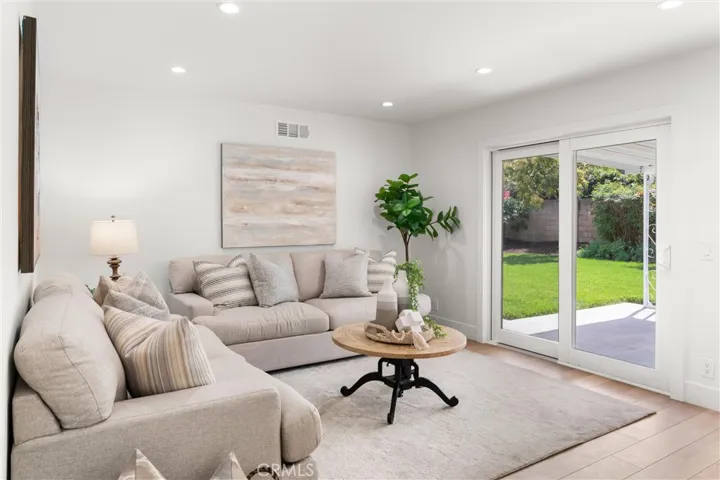 Large family room with sliding door access to the backyard