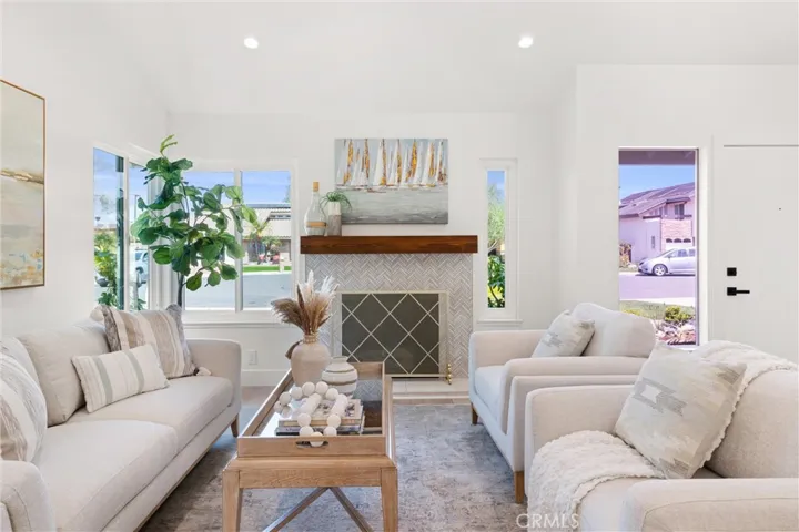 Notice the herringbone tiled fireplace.