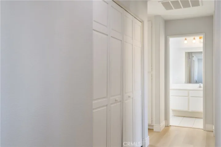 Upstairs Hallway with Laundry Area in closet