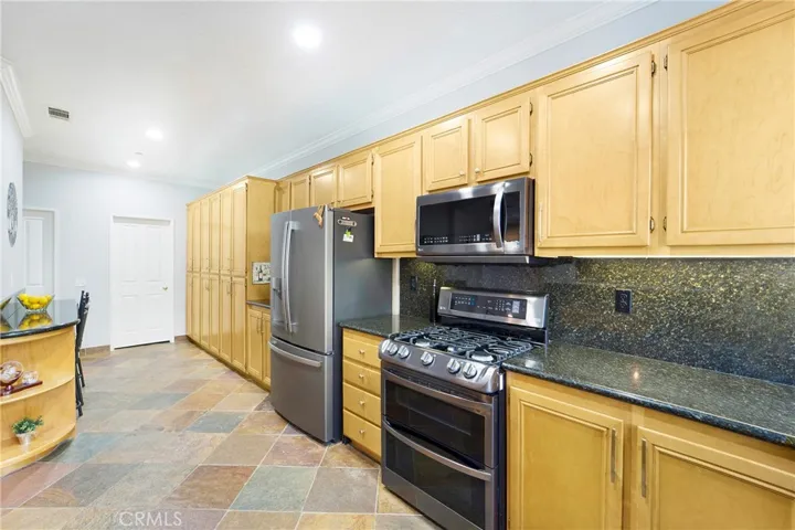 The gourmet kitchen offers generous counter space and extensive storage!