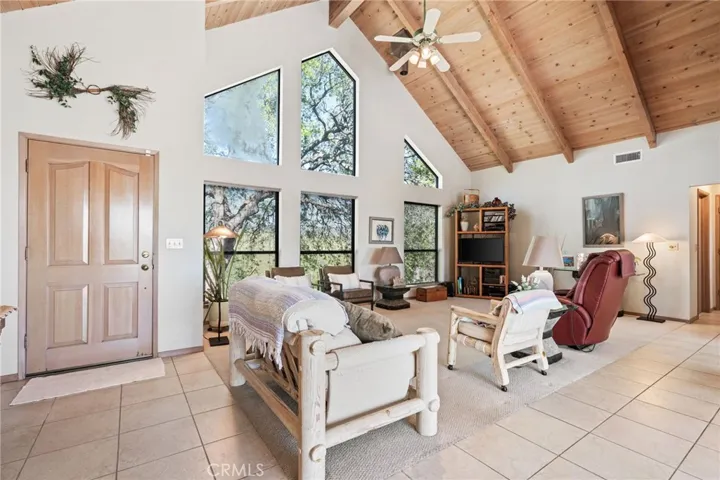 Living room w/ cathedral ceiling