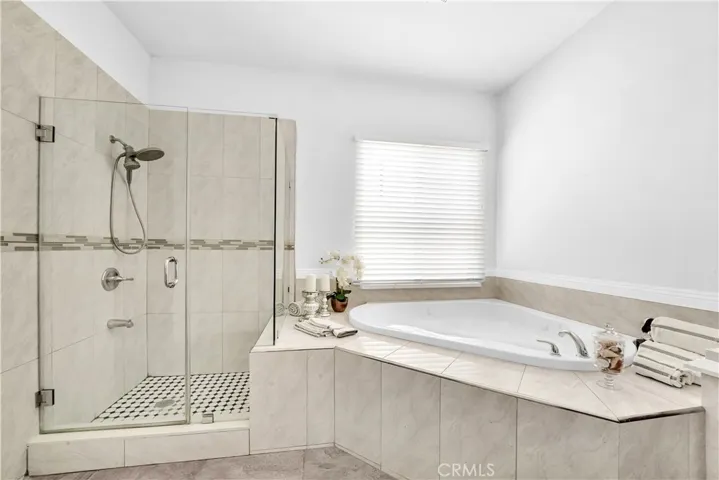 Primary Suite Spa-Style Bathroom with Jetted Soaking Tub, Separate Shower, Quartz Vanity, and Privacy Toilet