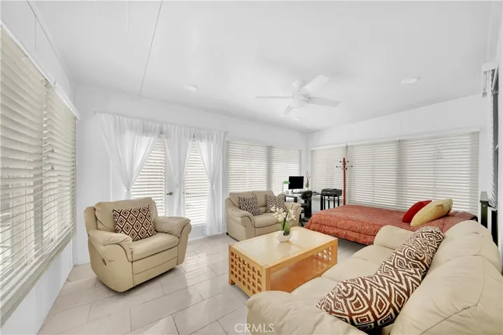 Beautiful Sunroom Addition with Marble Floors and French Doors