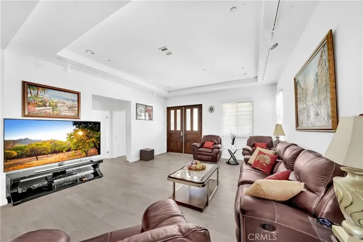 Living Room with Coffered High Ceilings