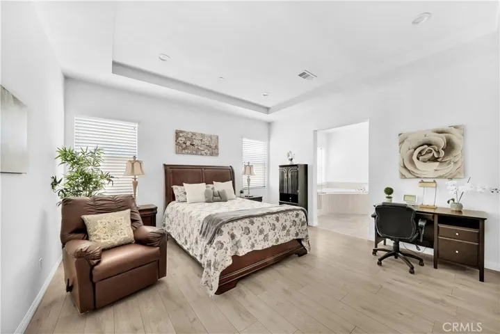 Primary Suite with Walk-In Closet, Sitting Area, and Luxurious Bathroom