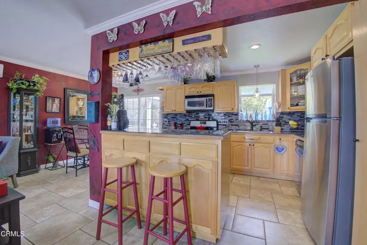 Kitchen includes a breakfast bar