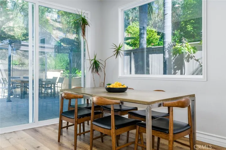 Dining space with sliders leading to back yard and patio