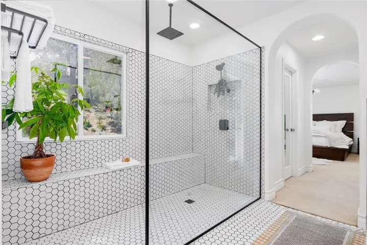 Curbless shower offers a seamless transition from shower to bathroom