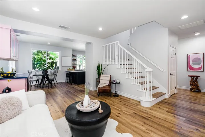 Stairs leading to bedrooms and additional flex space
