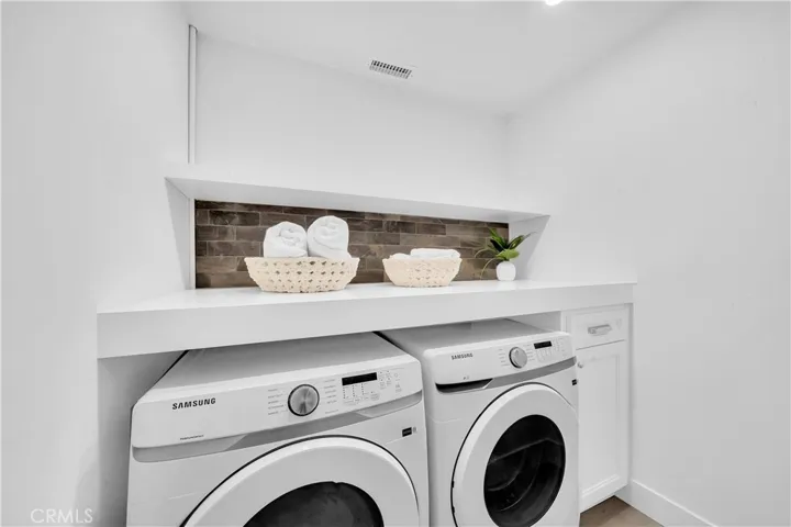 LAUNDRY ROOM WITH FULL SIZE WASHER AND DRYER
