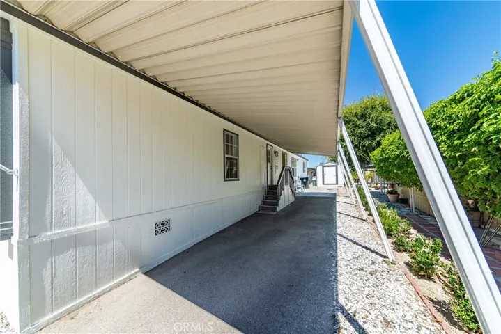 Parking spaces located on the right side with carport.
