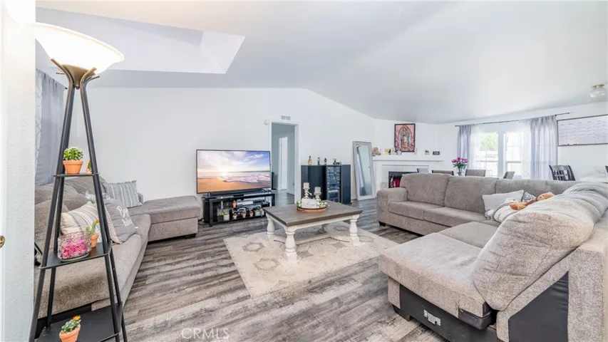 Bright natural light aluminates this grand living area.
